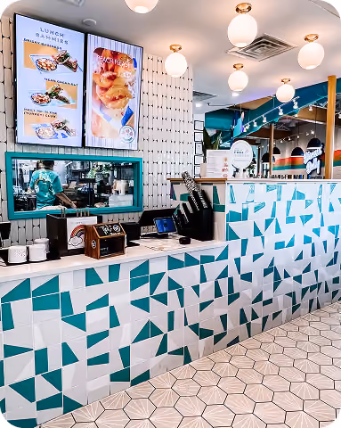 Retail counter finished with colorful teal geometric tile