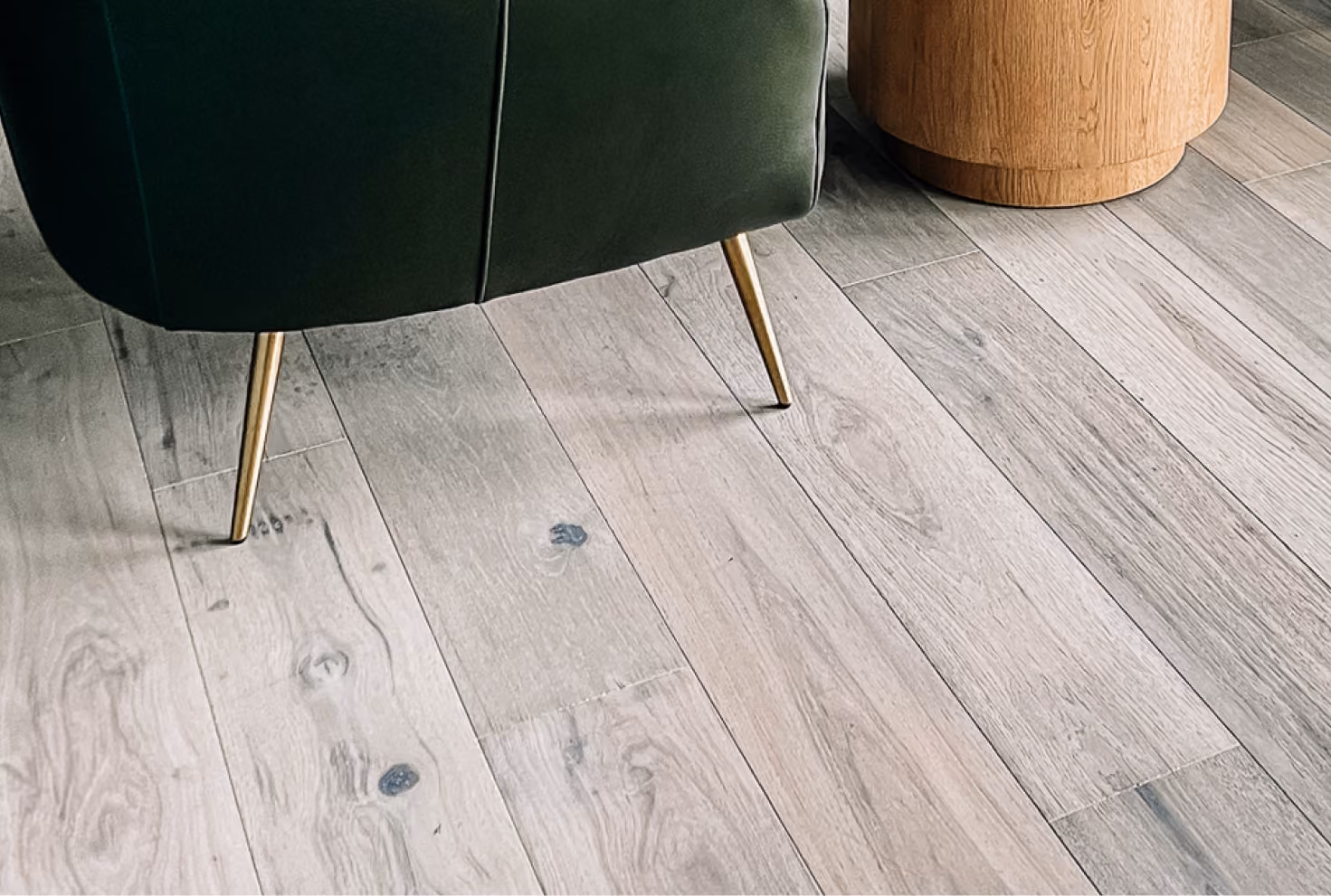 Close-up of gray wood-look luxury vinyl plank flooring