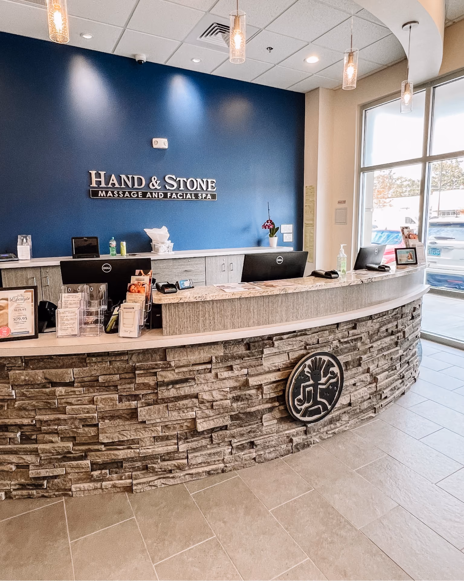 Spa reception desk finished with a stacked natural stone counter