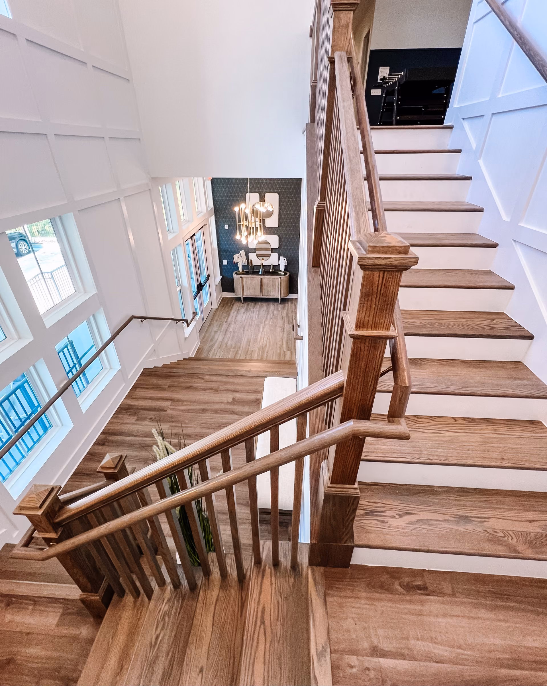 Overhead view of a staircase and foyer with hardwood flooring