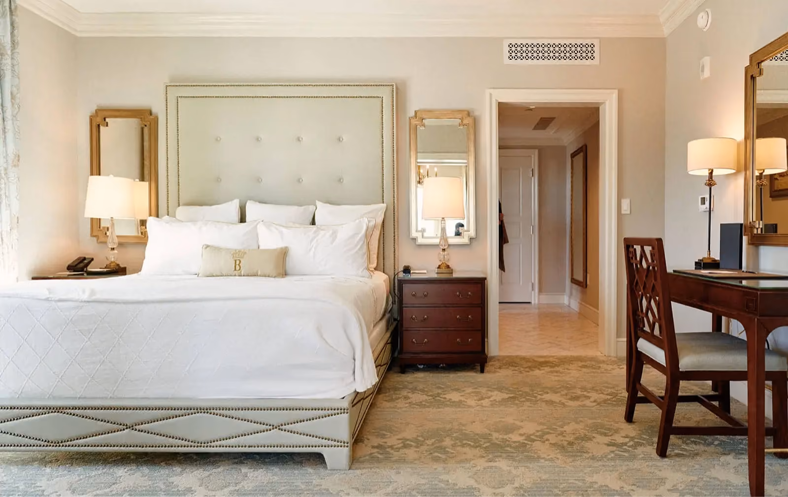 Hotel Bennett guest room with an upholstered bed and patterned carpet