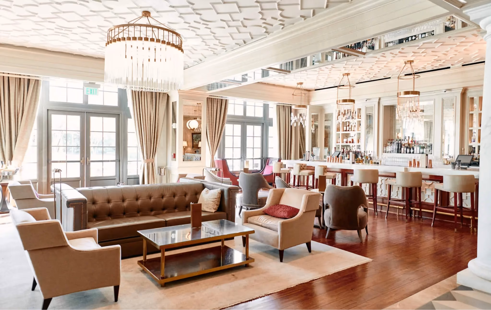 Hotel Bennett lobby lounge with dark hardwood flooring and a chandelier