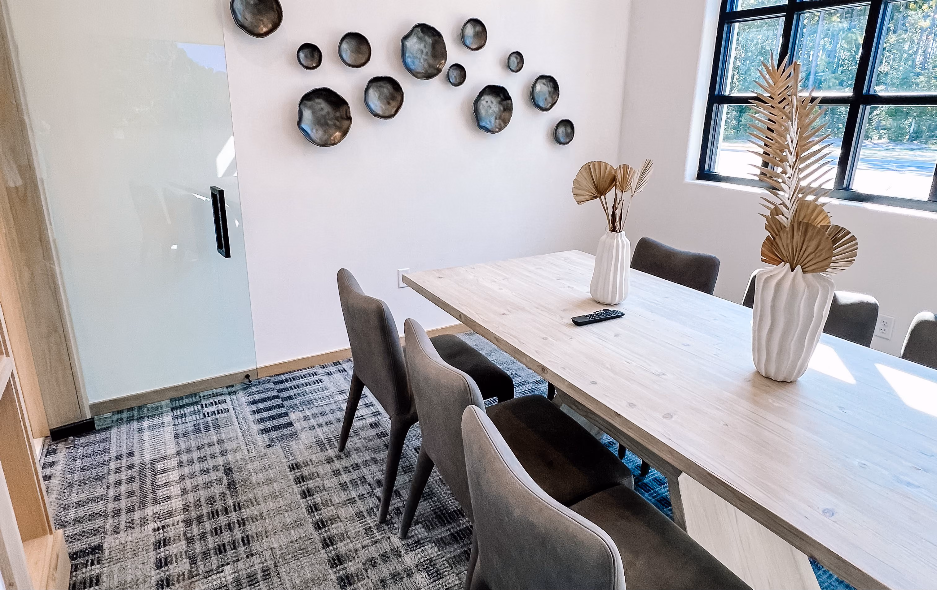 Community dining nook with a round table and tile flooring