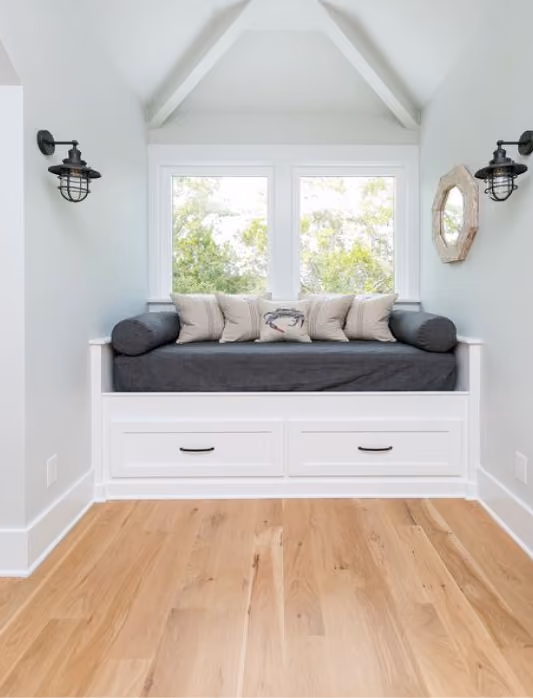 Built-in window bench seating on hardwood flooring