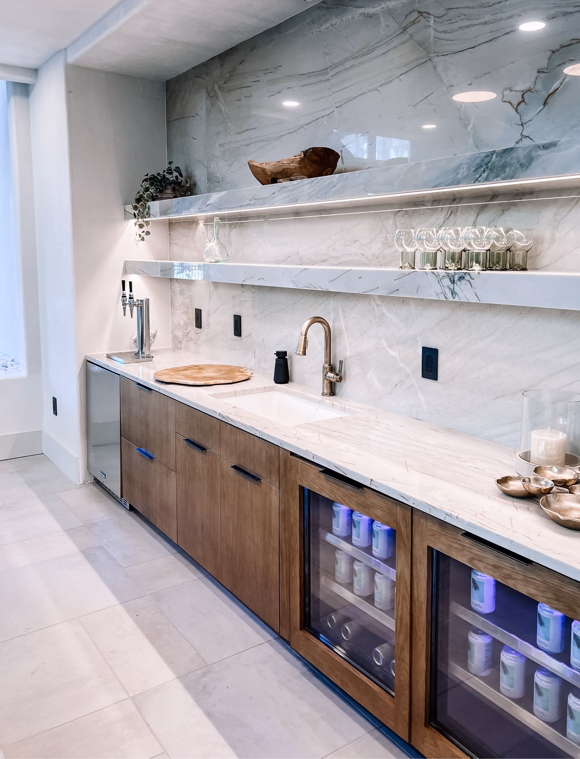 Bar area with a marble countertop and wood-look flooring