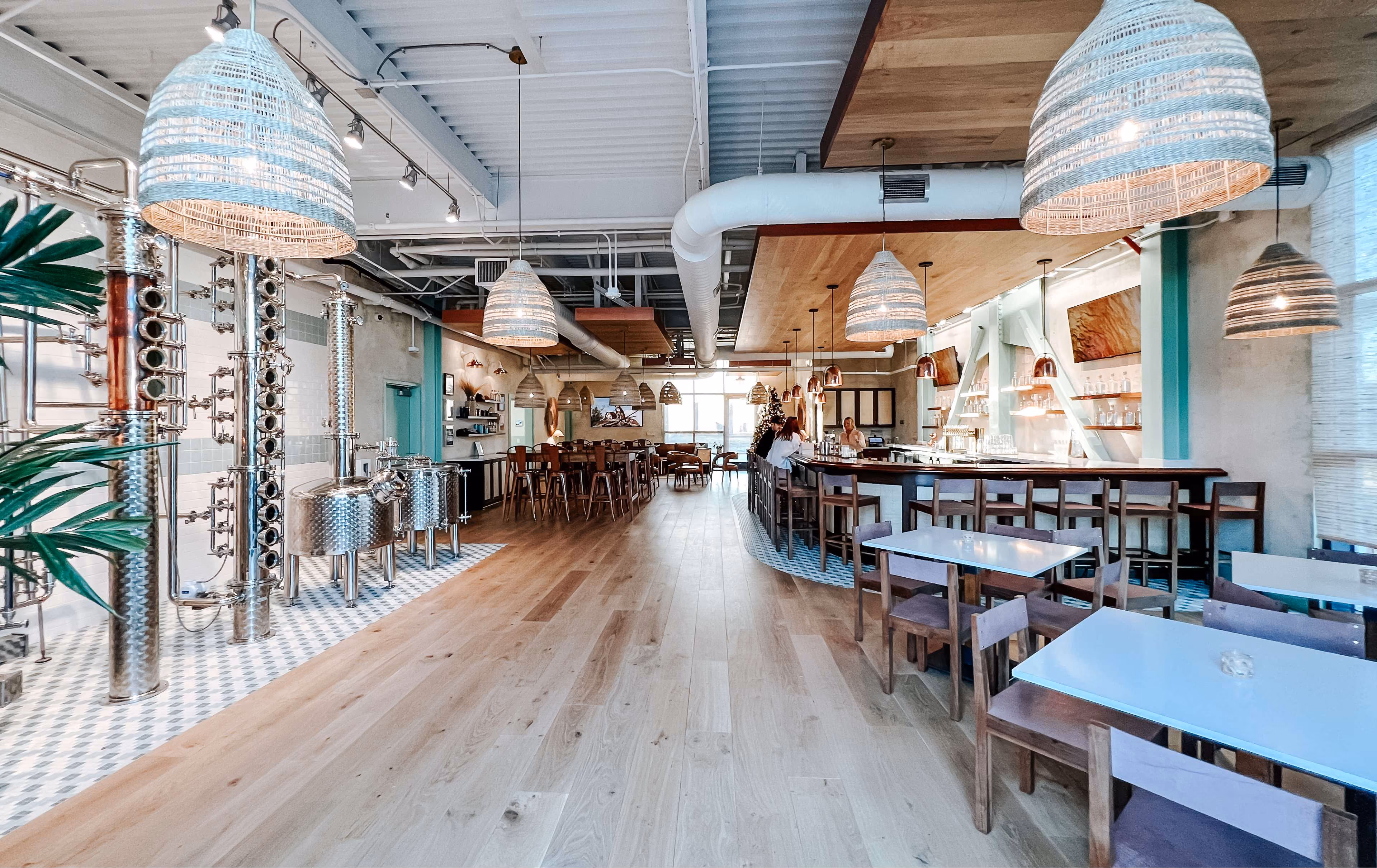 Restaurant dining room with hardwood flooring and pendant lighting