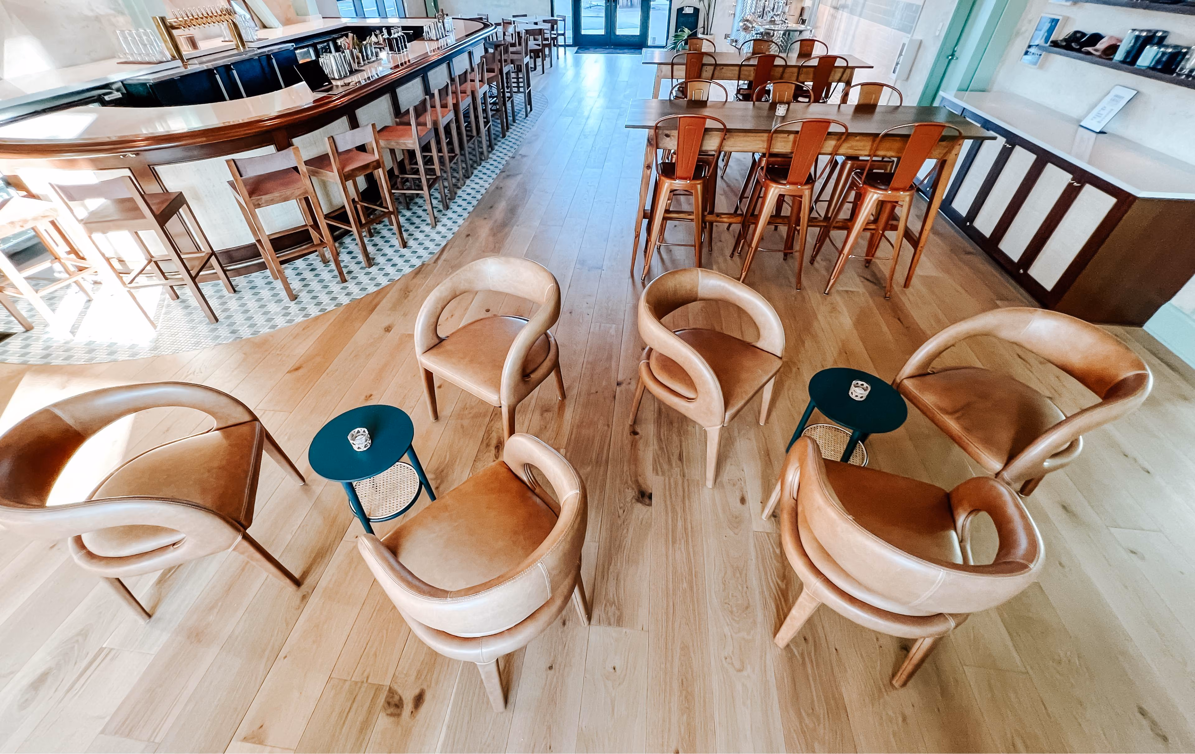 Overhead view of a restaurant dining area with tile and hardwood flooring