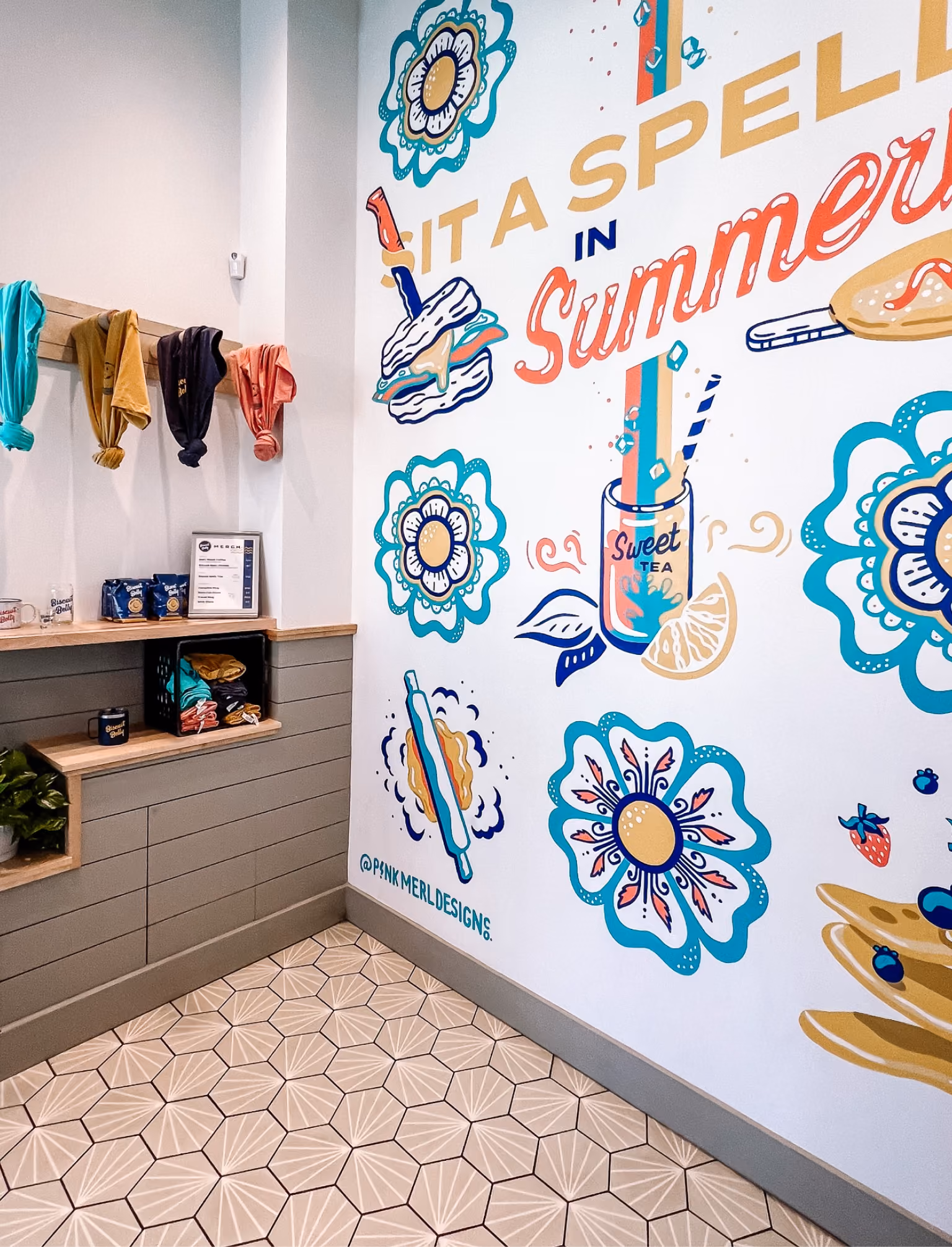 Restaurant wall mural with teal patterned tile flooring