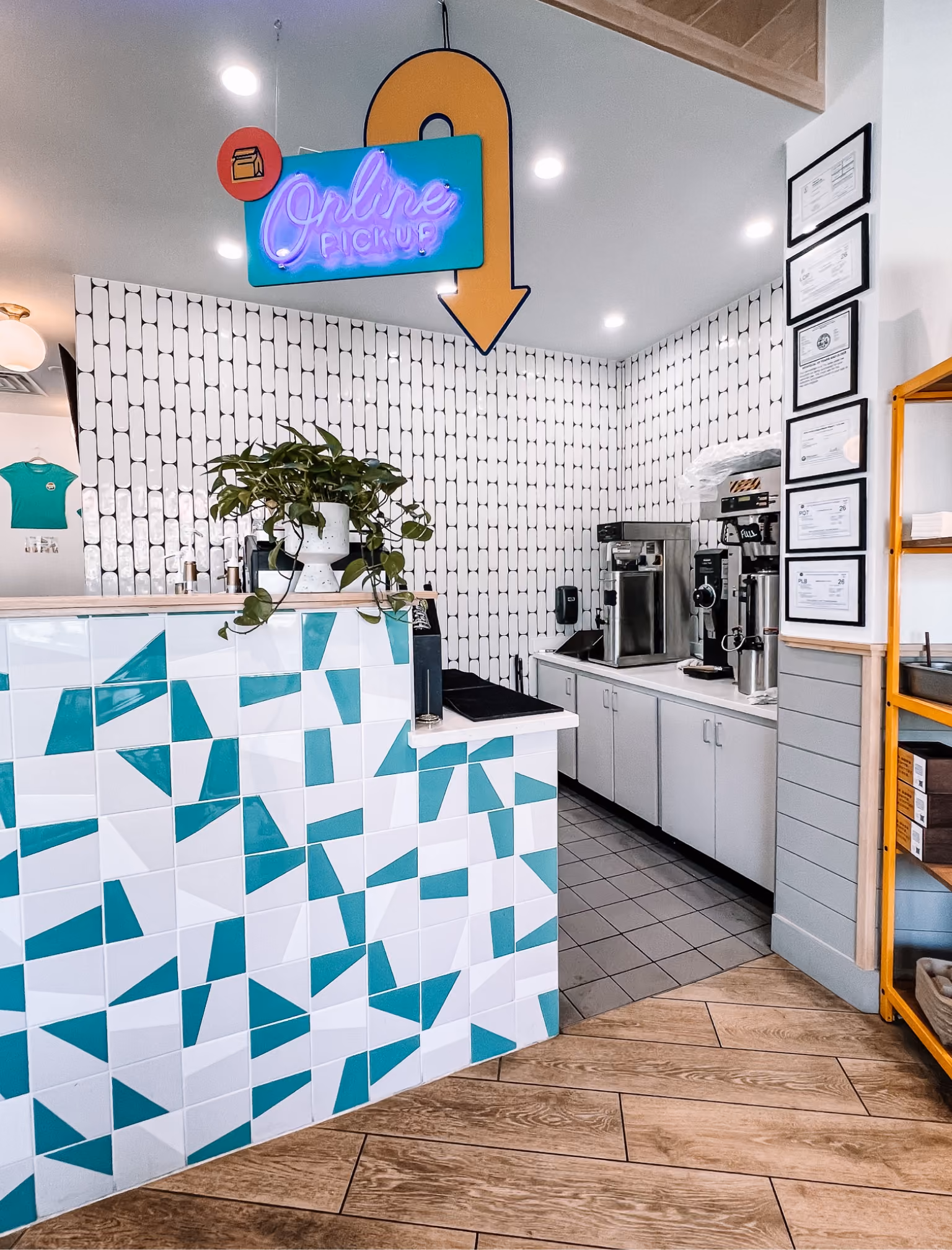 Restaurant kitchen counter area with teal patterned tile flooring