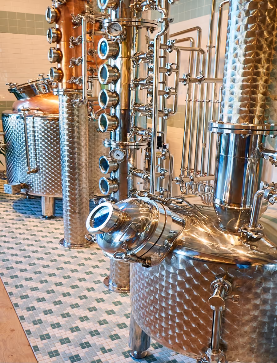 Distillery equipment on patterned tile flooring