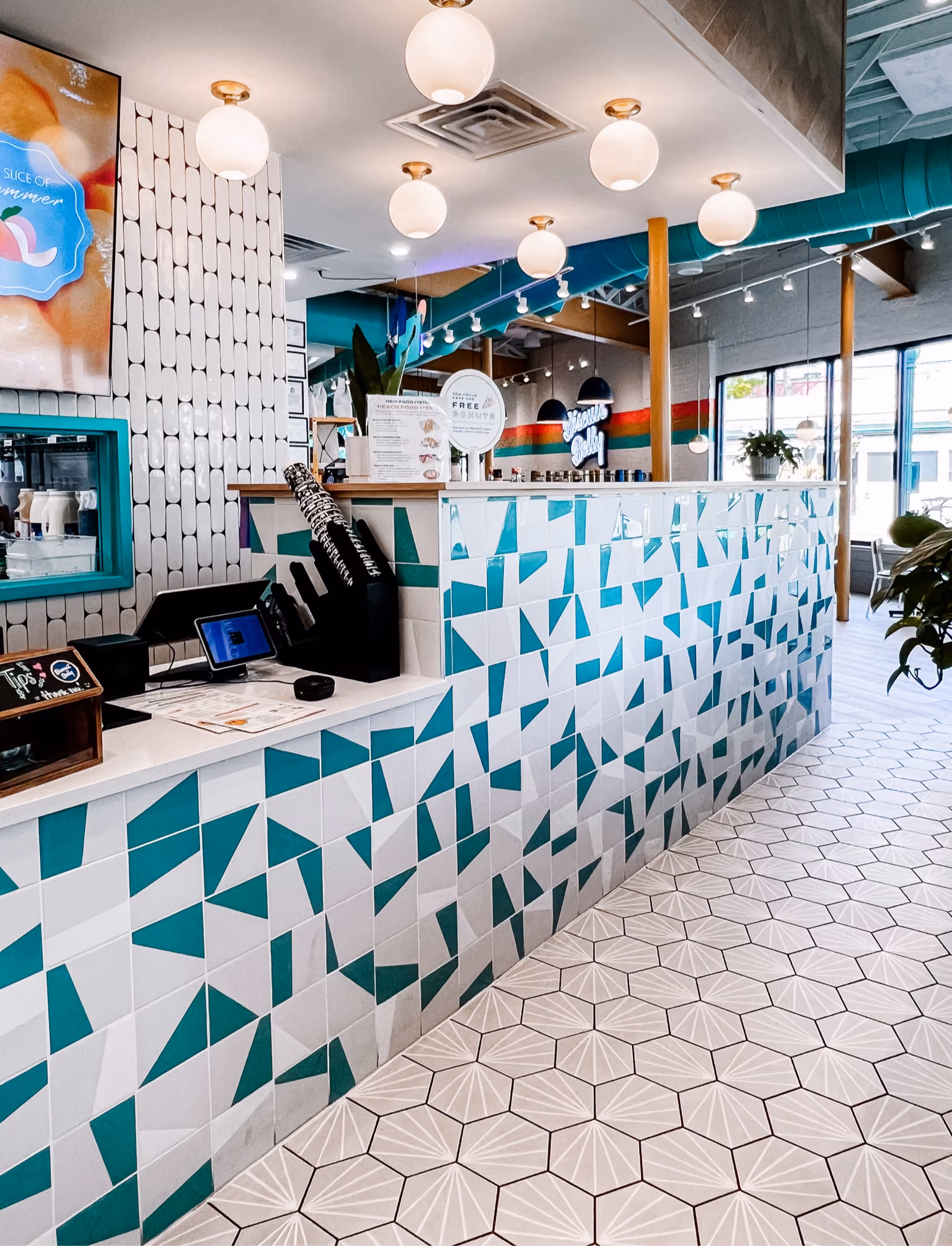 Restaurant interior with teal geometric patterned tile flooring