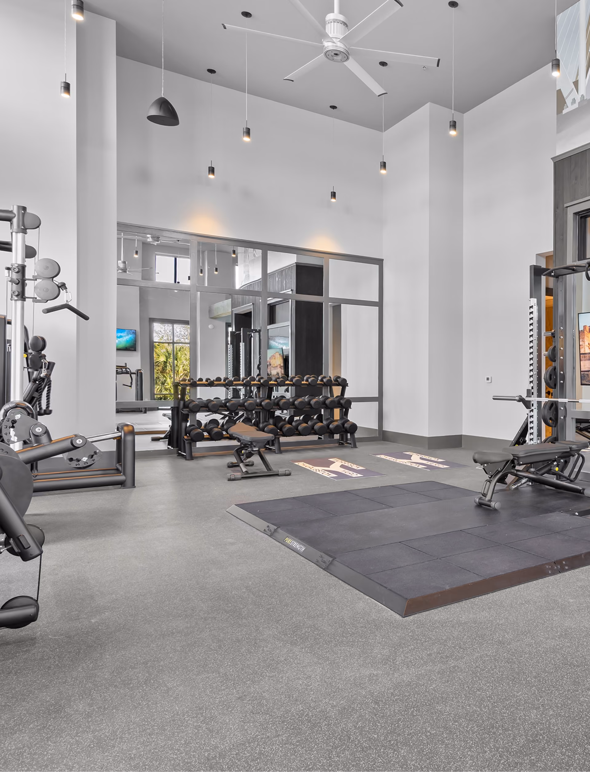 Fitness center with weight equipment on rubber flooring