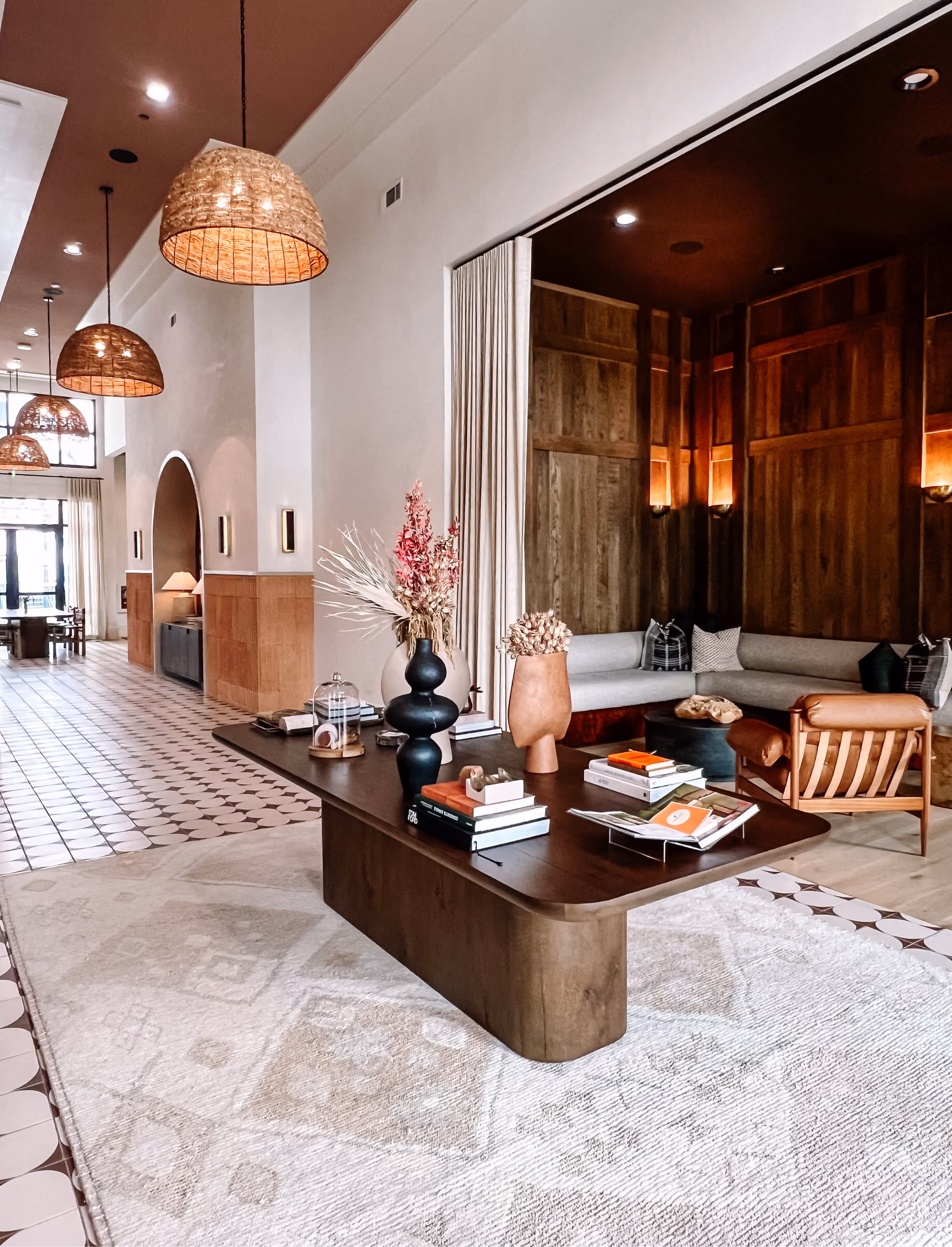 Lounge area with round tables and patterned tile flooring