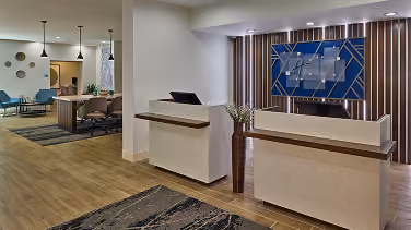 Hotel reception desk with patterned tile flooring