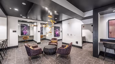 Commercial lobby lounge with accent chairs on tile flooring