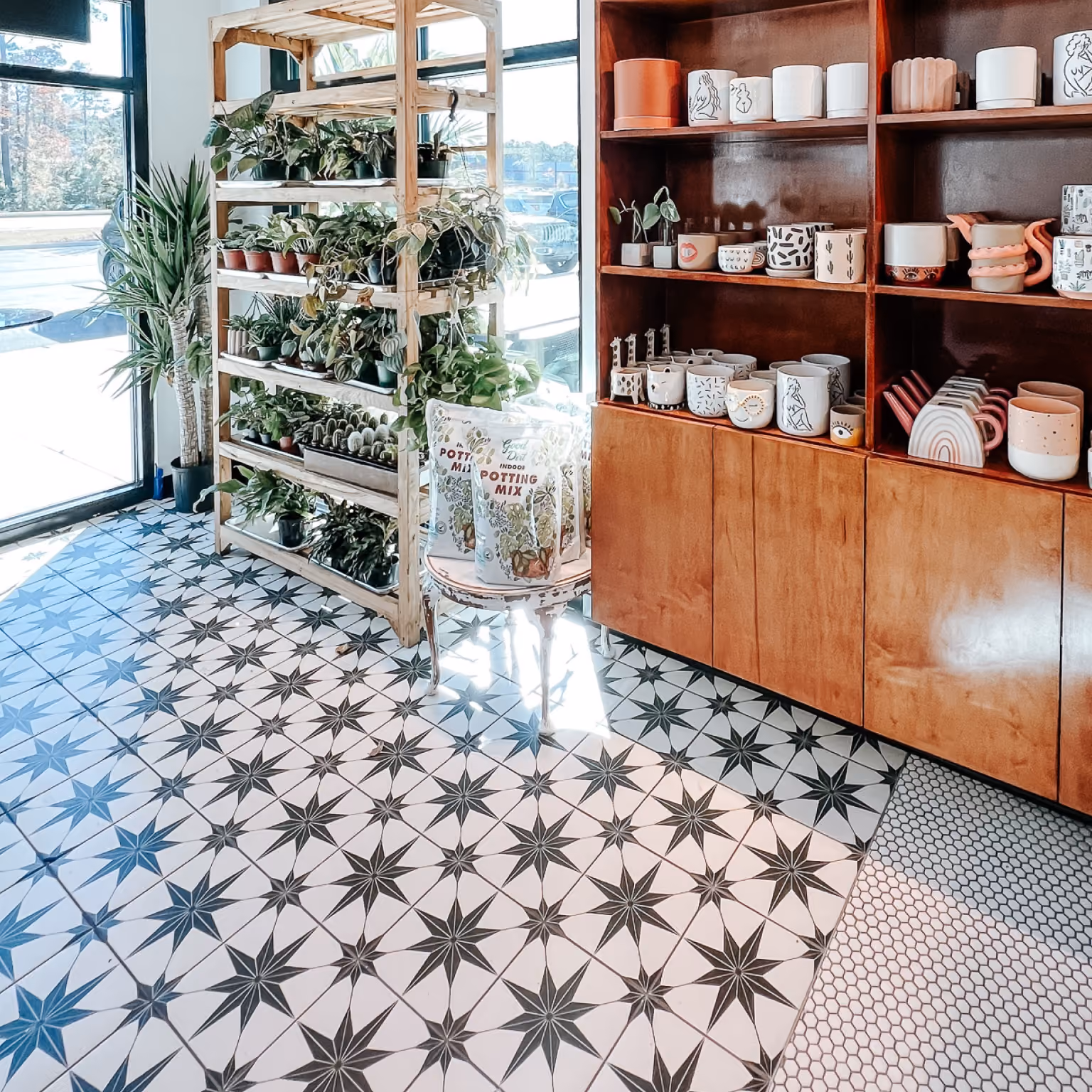 Hotel bar and reception area with black and white patterned tile flooring