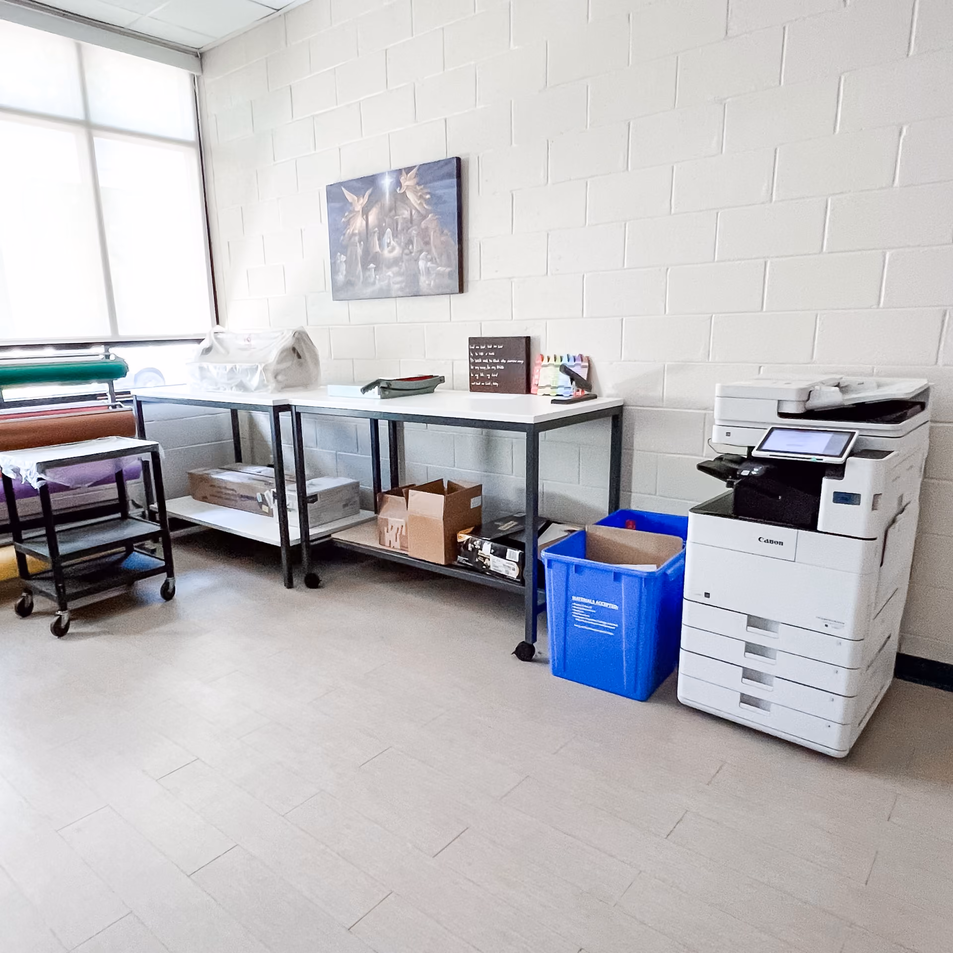 School office area with light gray flooring and a workstation