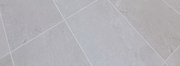 Close-up of light gray tile flooring