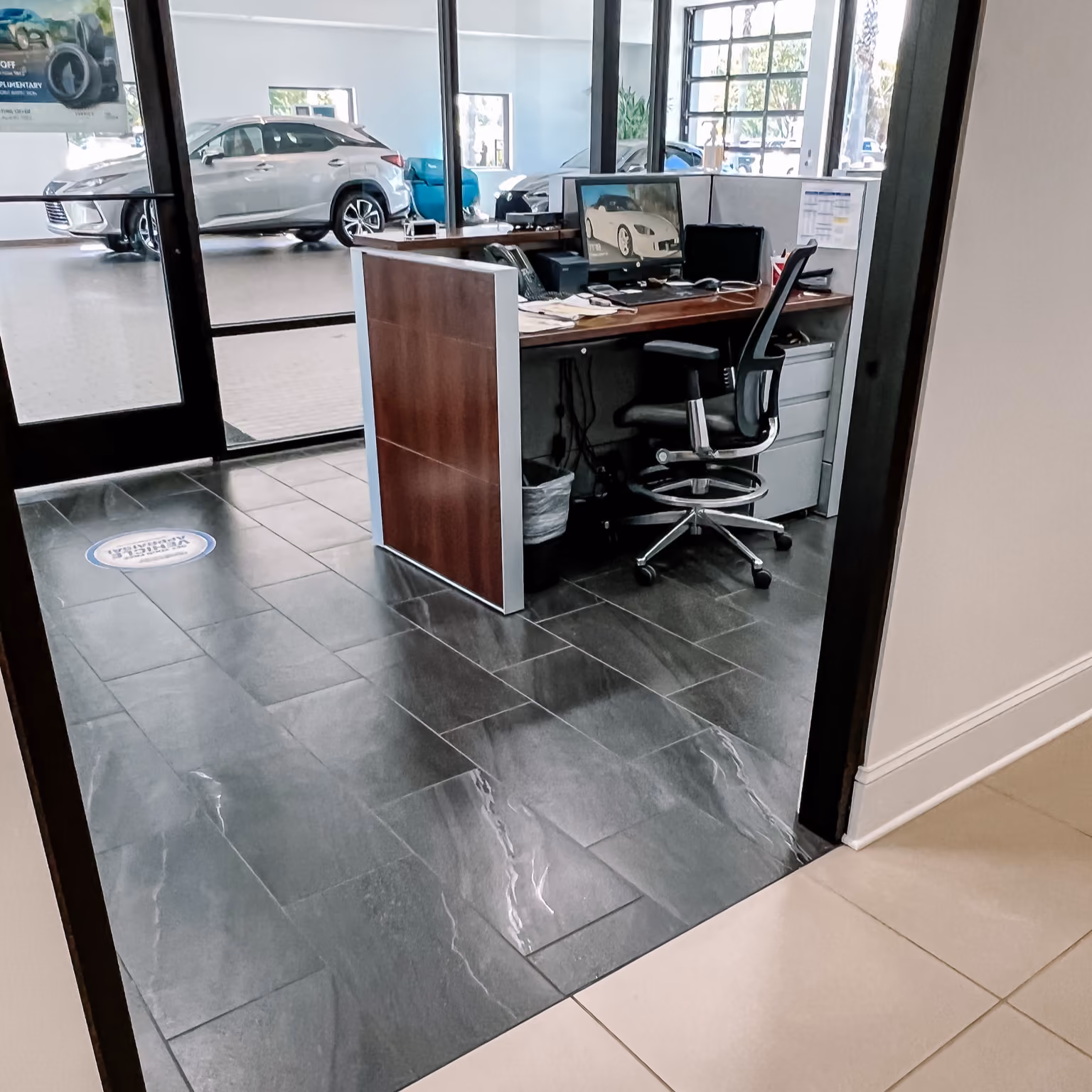 Dealership service reception desk with light gray flooring