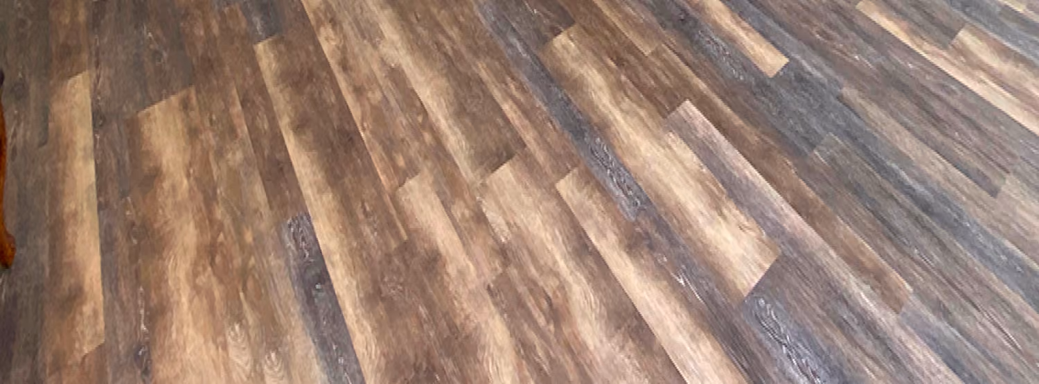 Close-up of medium-tone wood-look plank flooring