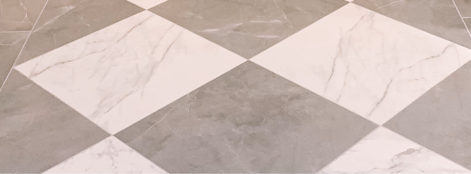 Close-up of gray and white diamond-pattern floor tile
