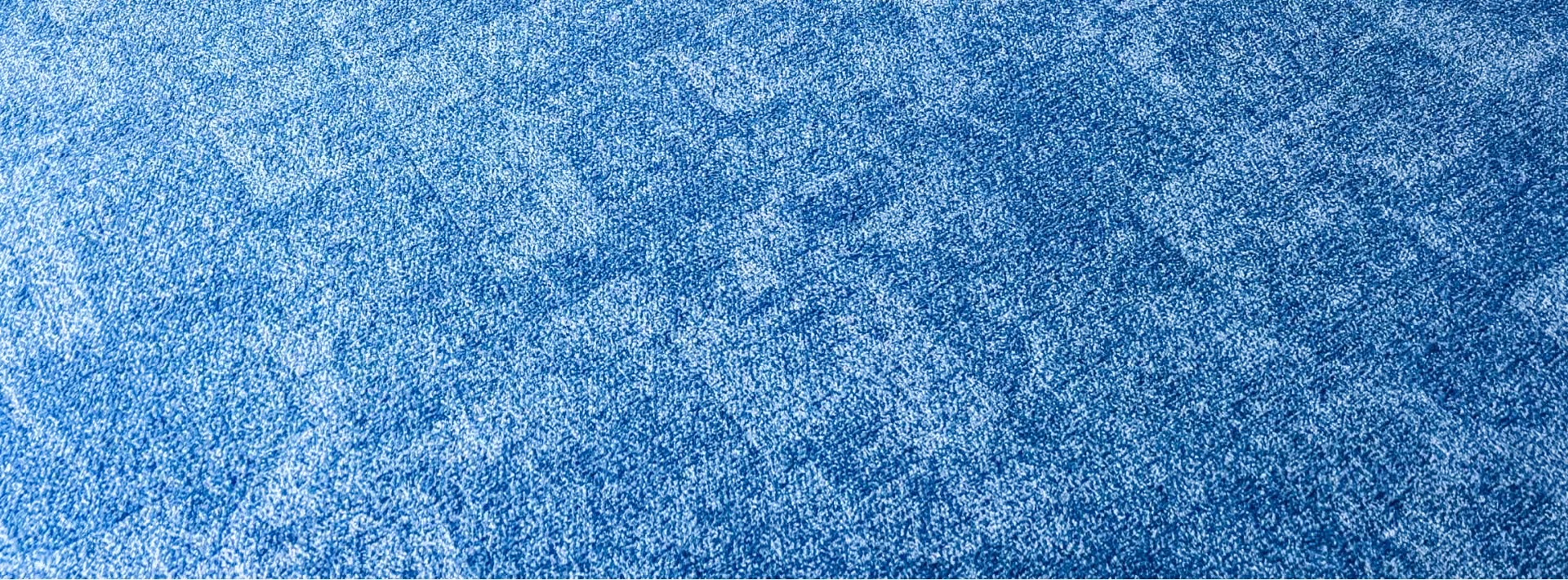 Close-up of blue speckled carpet flooring