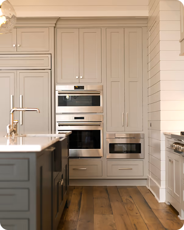 New construction kitchen with black appliances and hardwood flooring