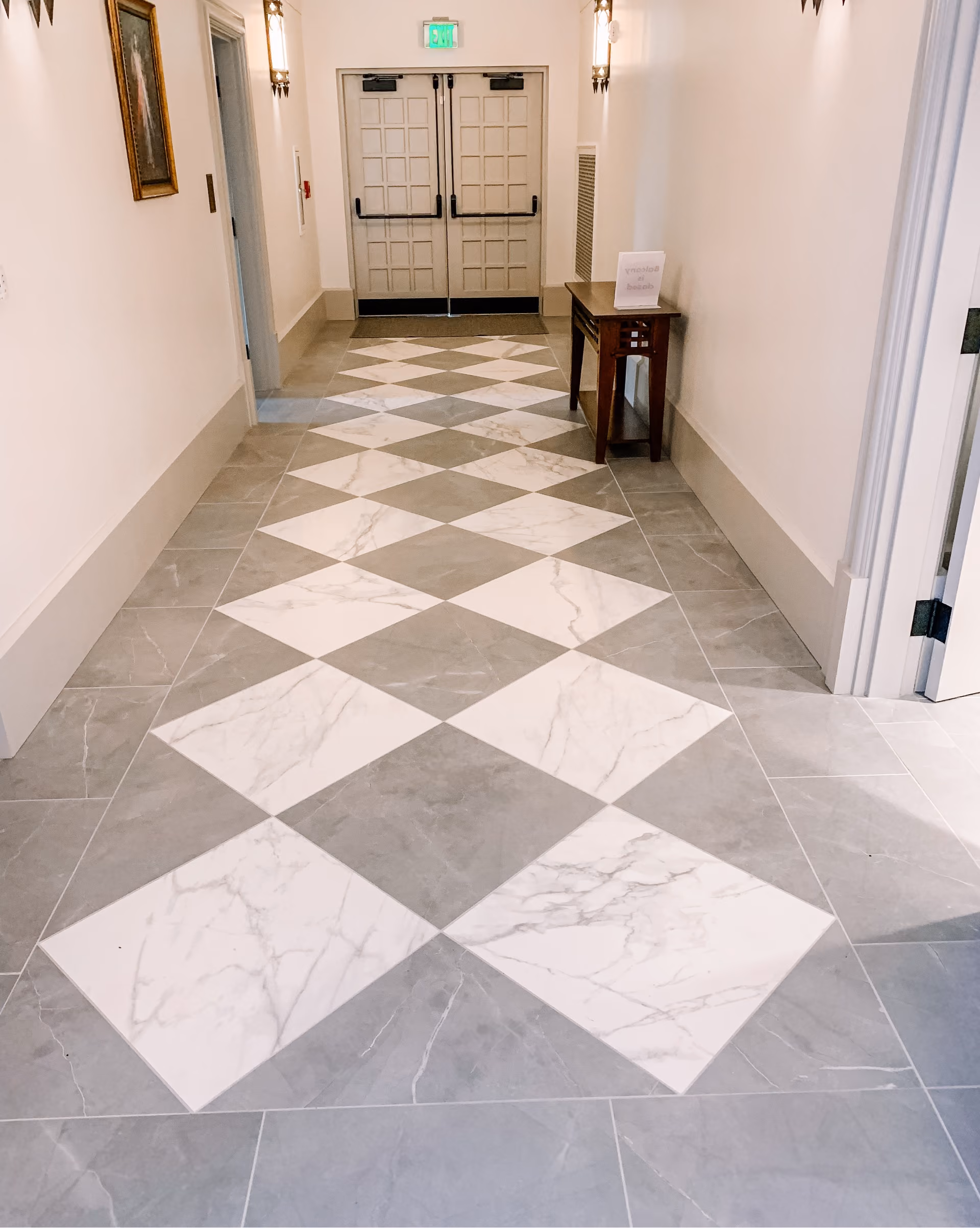 Church entryway with black and white diamond-pattern floor tile