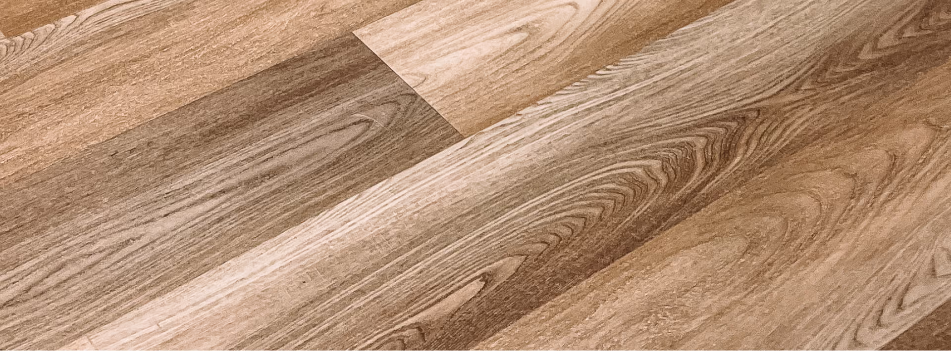 Close-up of medium-tone wood-look plank flooring