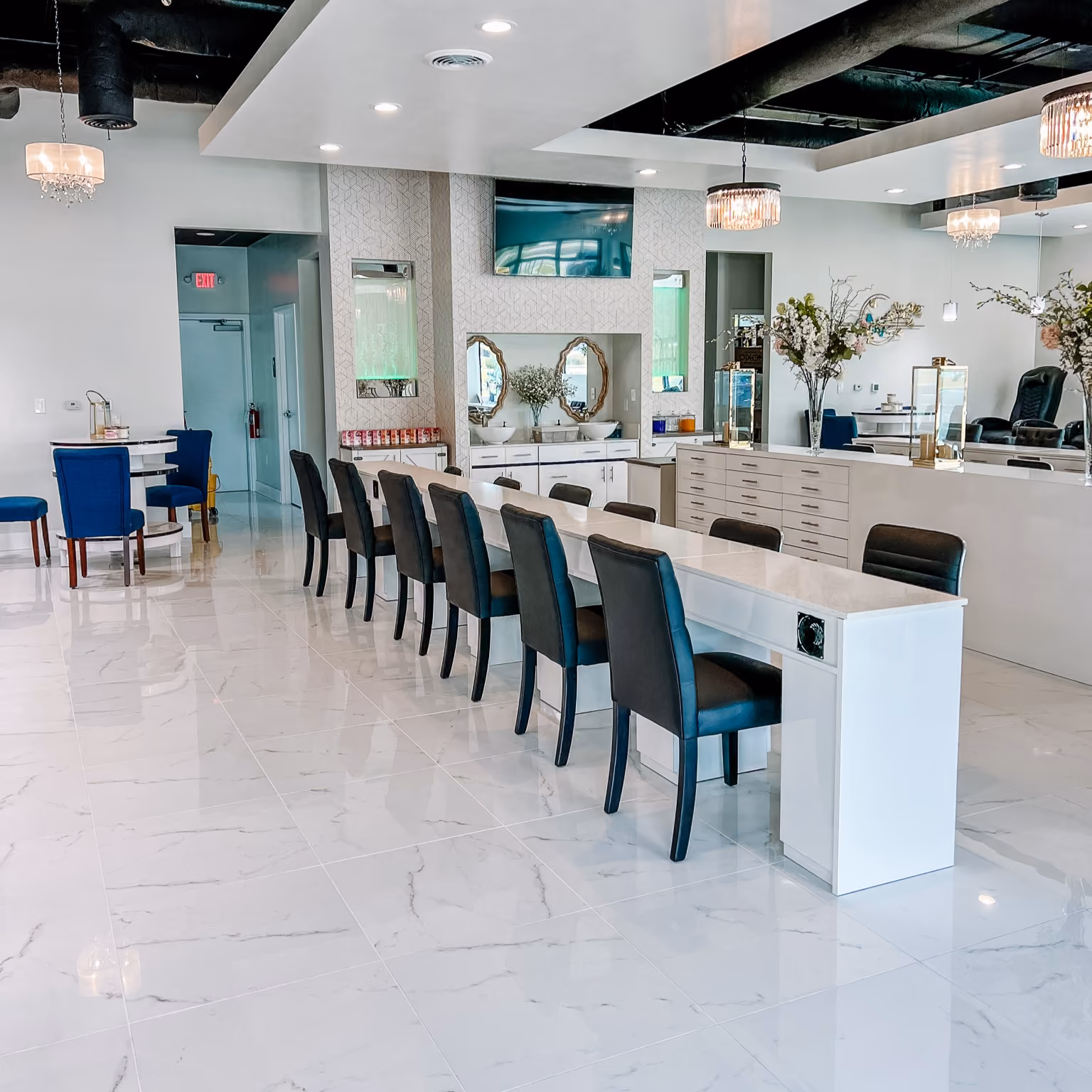 Commercial retail checkout counter with a teal accent wall and light wood-look flooring