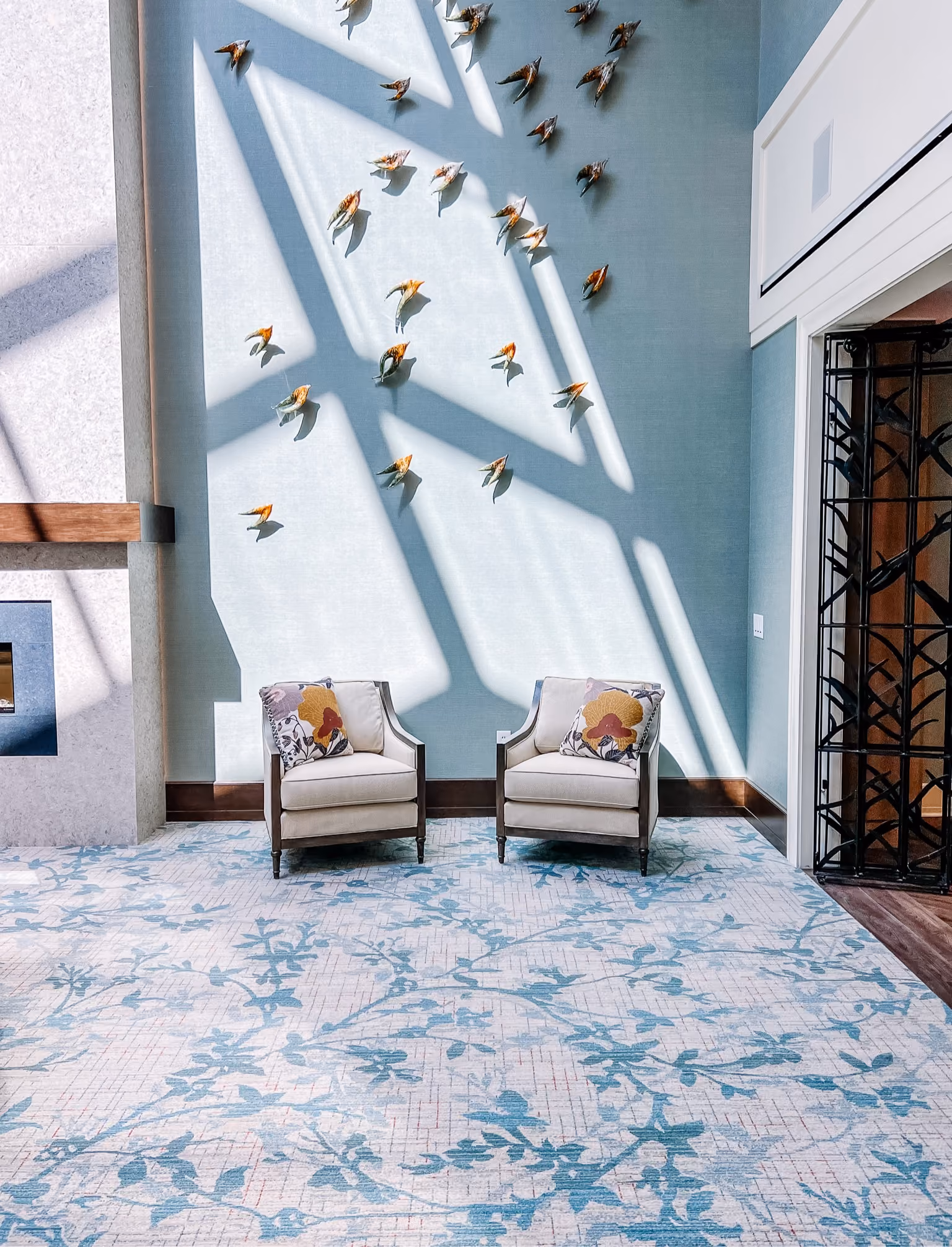 Senior living common area with skylights and light wood-look flooring