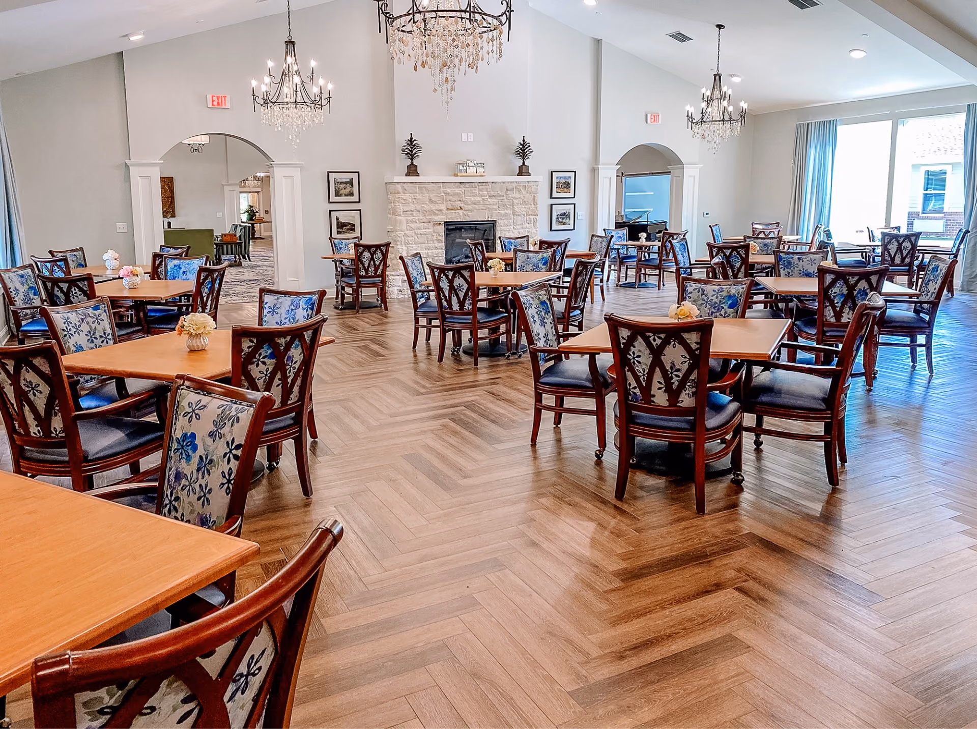 Senior living dining area with wood-look flooring and dining chairs