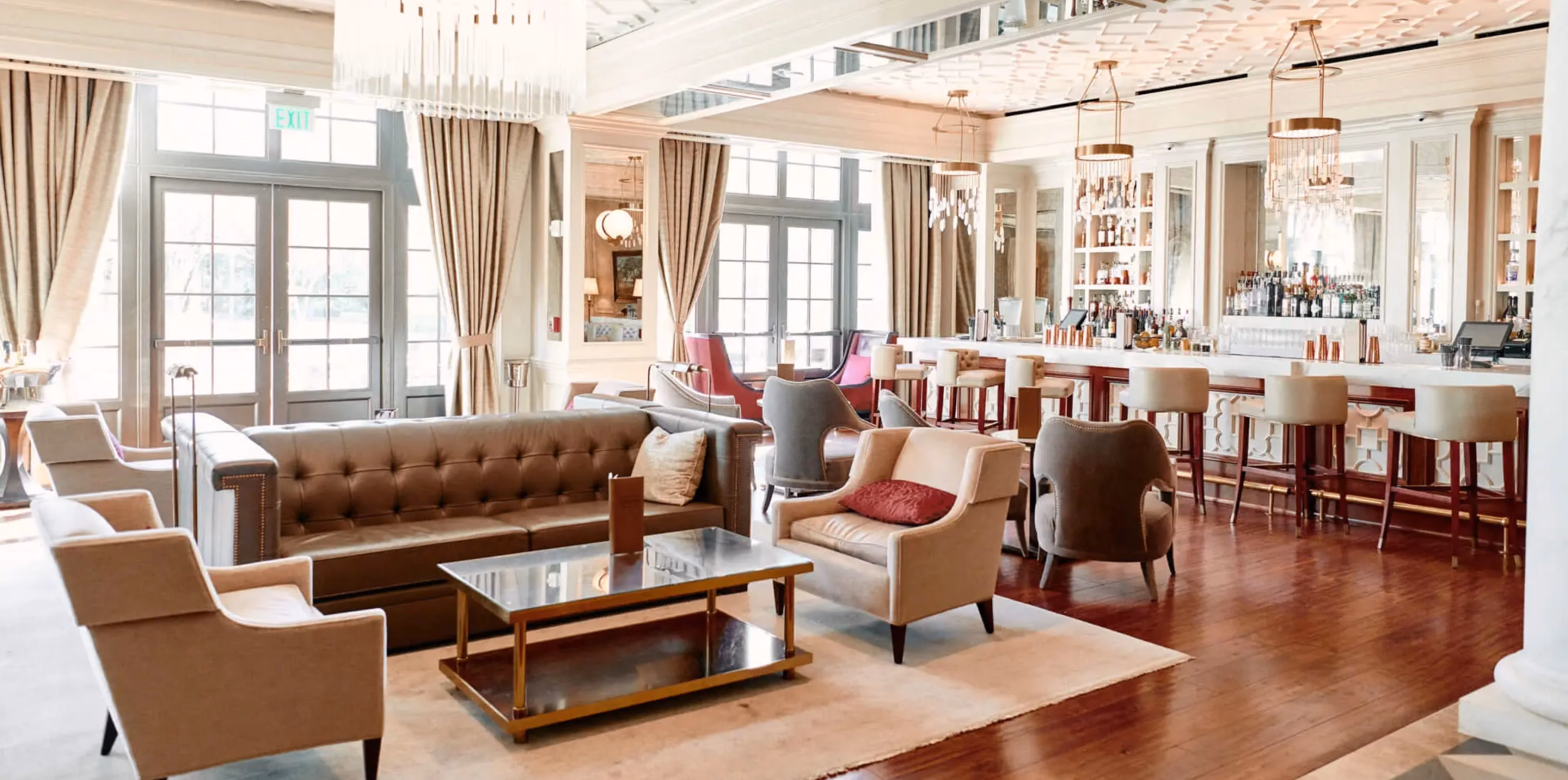 Hotel lobby lounge with leather armchairs and rich wood flooring