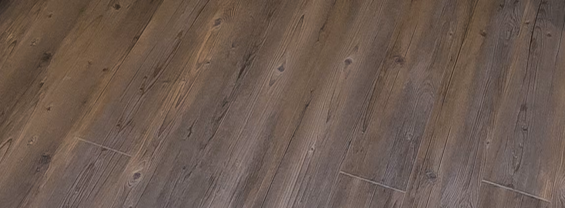Close-up of dark gray wood-look plank flooring