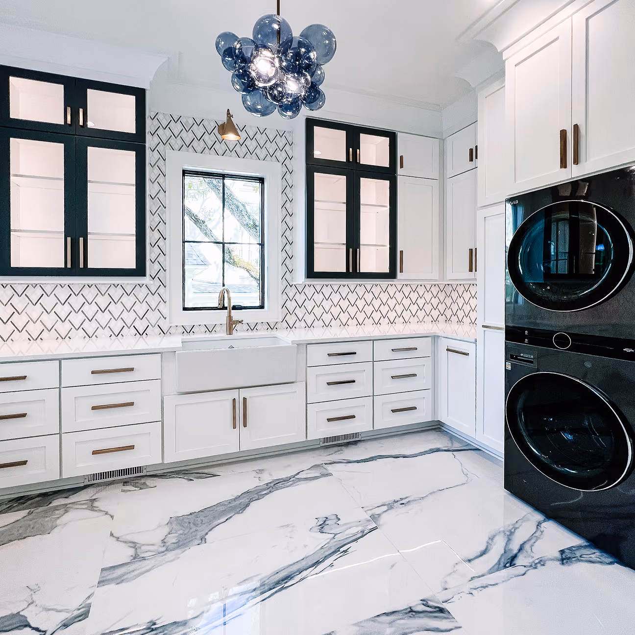 Residential kitchen with a herringbone tile backsplash and hardwood flooring