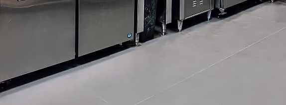 Close-up of light gray textured resilient flooring