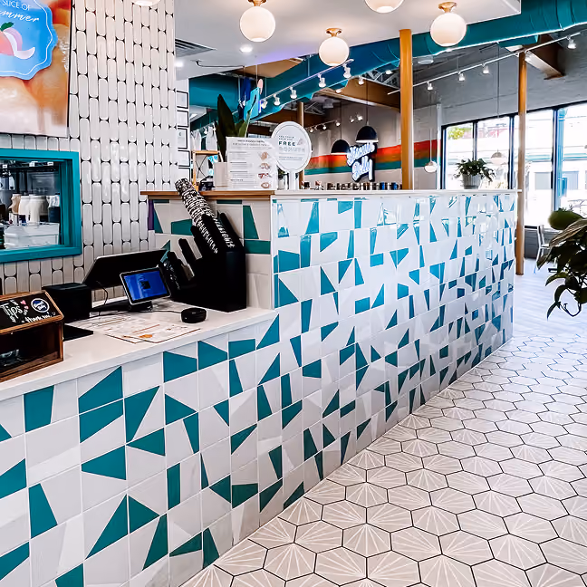 Restaurant retail counter with patterned mosaic tile flooring