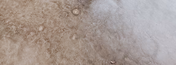 Close-up of mottled brown terrazzo-look flooring