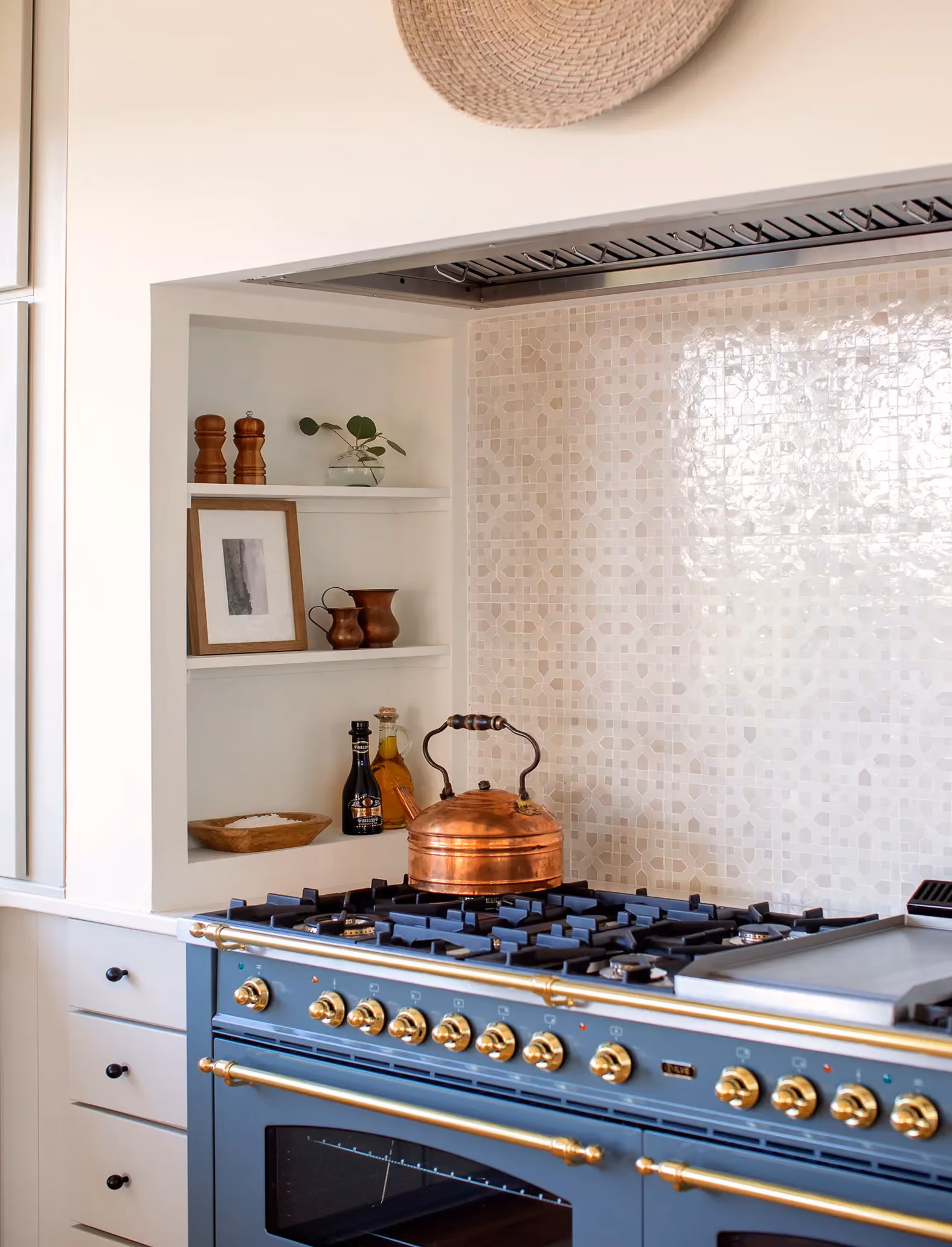 Residential kitchen nook with open shelving and a tile backsplash
