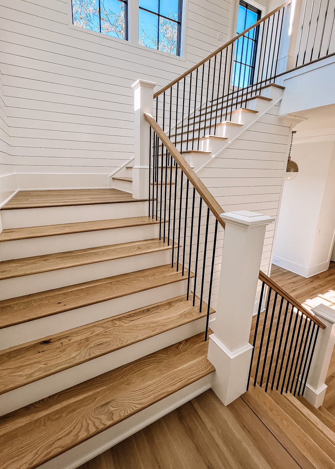 Residential staircase with wood treads and white risers