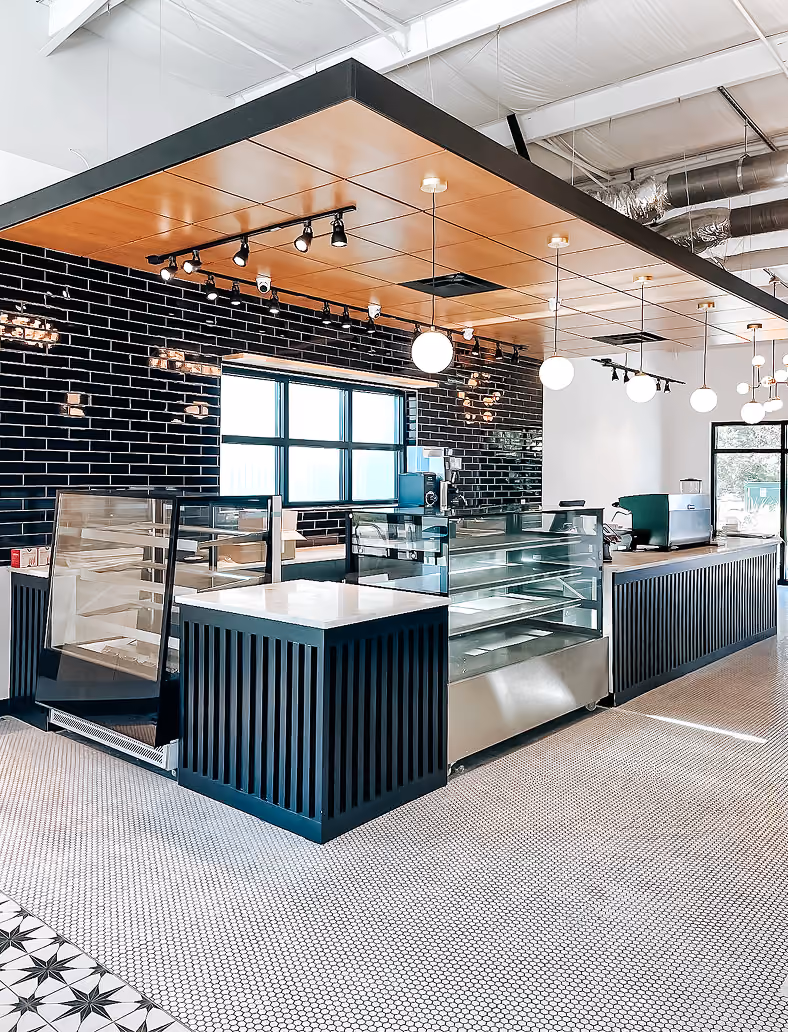 Restaurant bakery display case with black tile flooring
