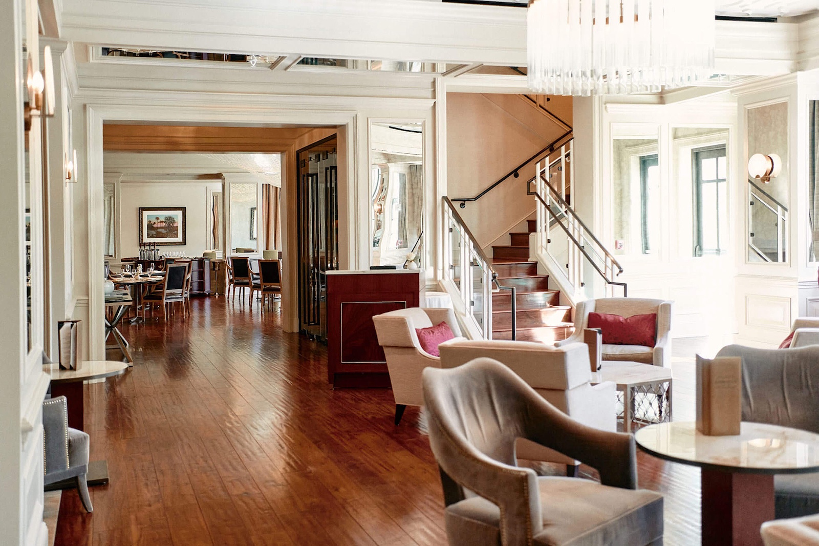 Hotel Bennett dining area and staircase with dark hardwood flooring