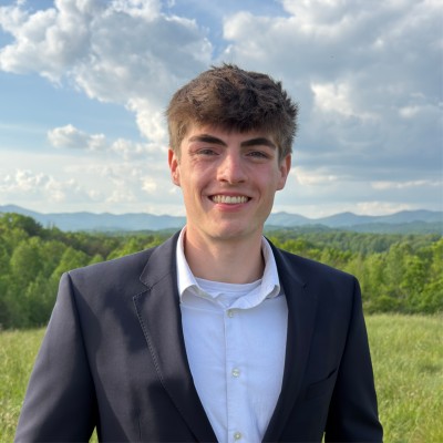 Evan Westling, founder of Adamah Marketing, standing in the North Georgia foothills
