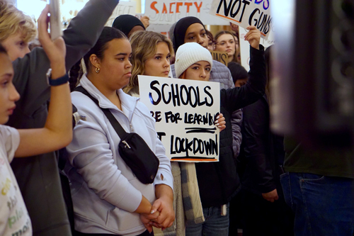 A group of young people rally at the Iowa Capitol about gun safety in schools