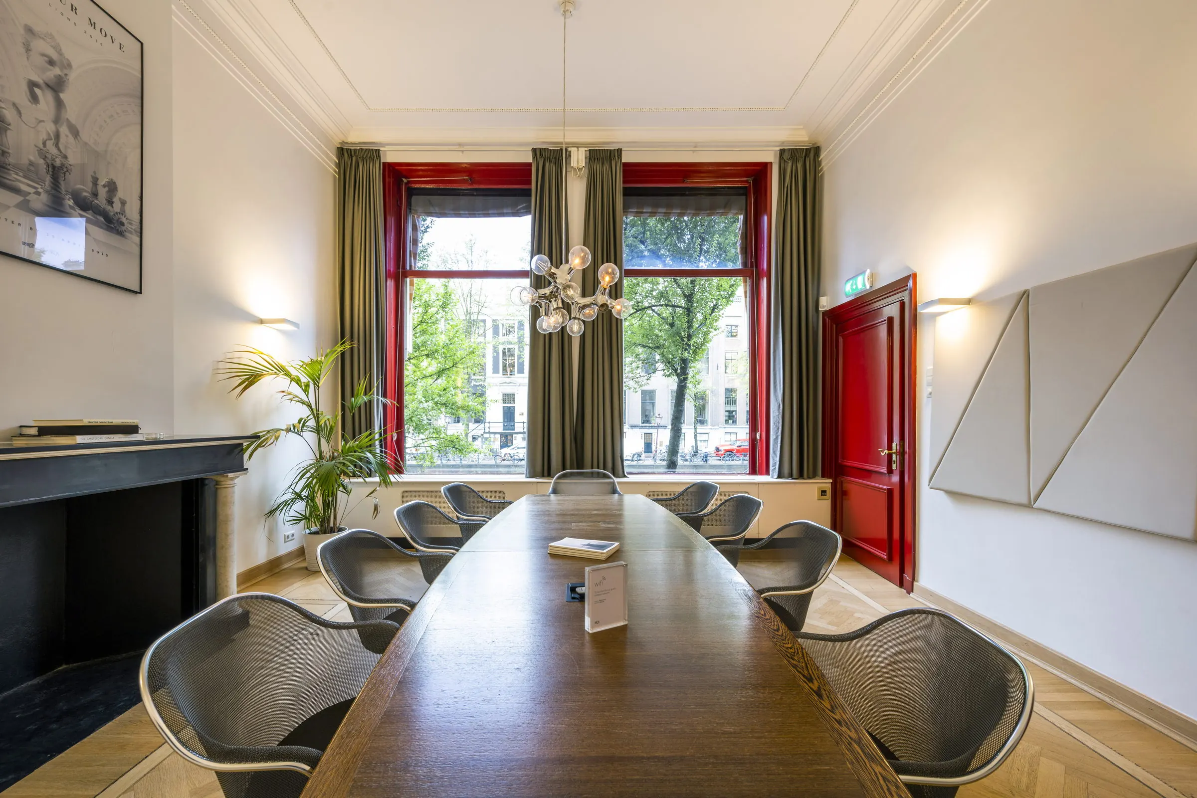 Boardroom with fireplace and canal-side windows
