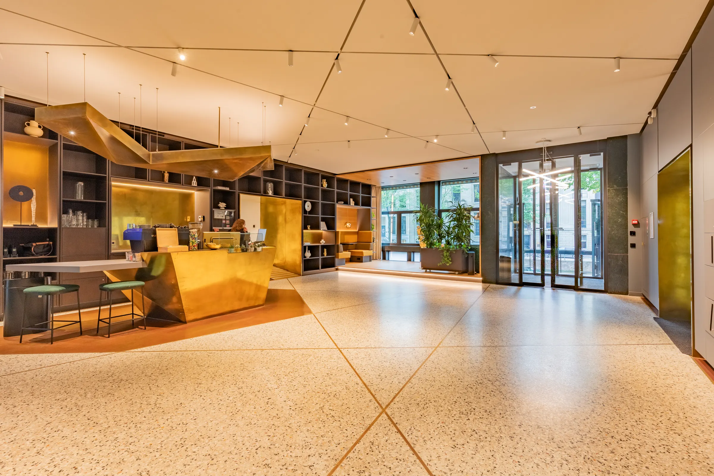 Lounge and reception area with a terrazzo floor
