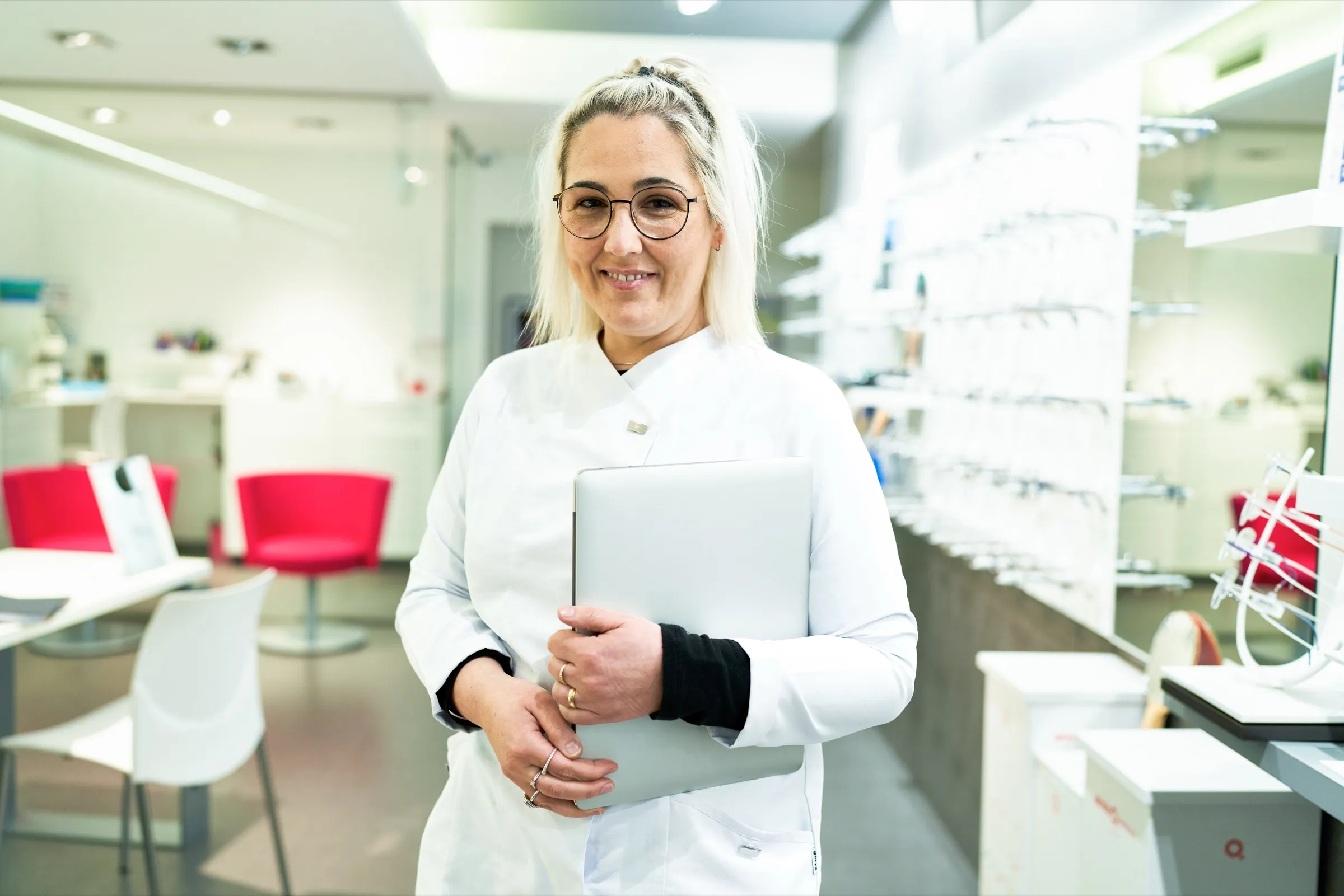 Optometrist standing in an eyewear dispensary
