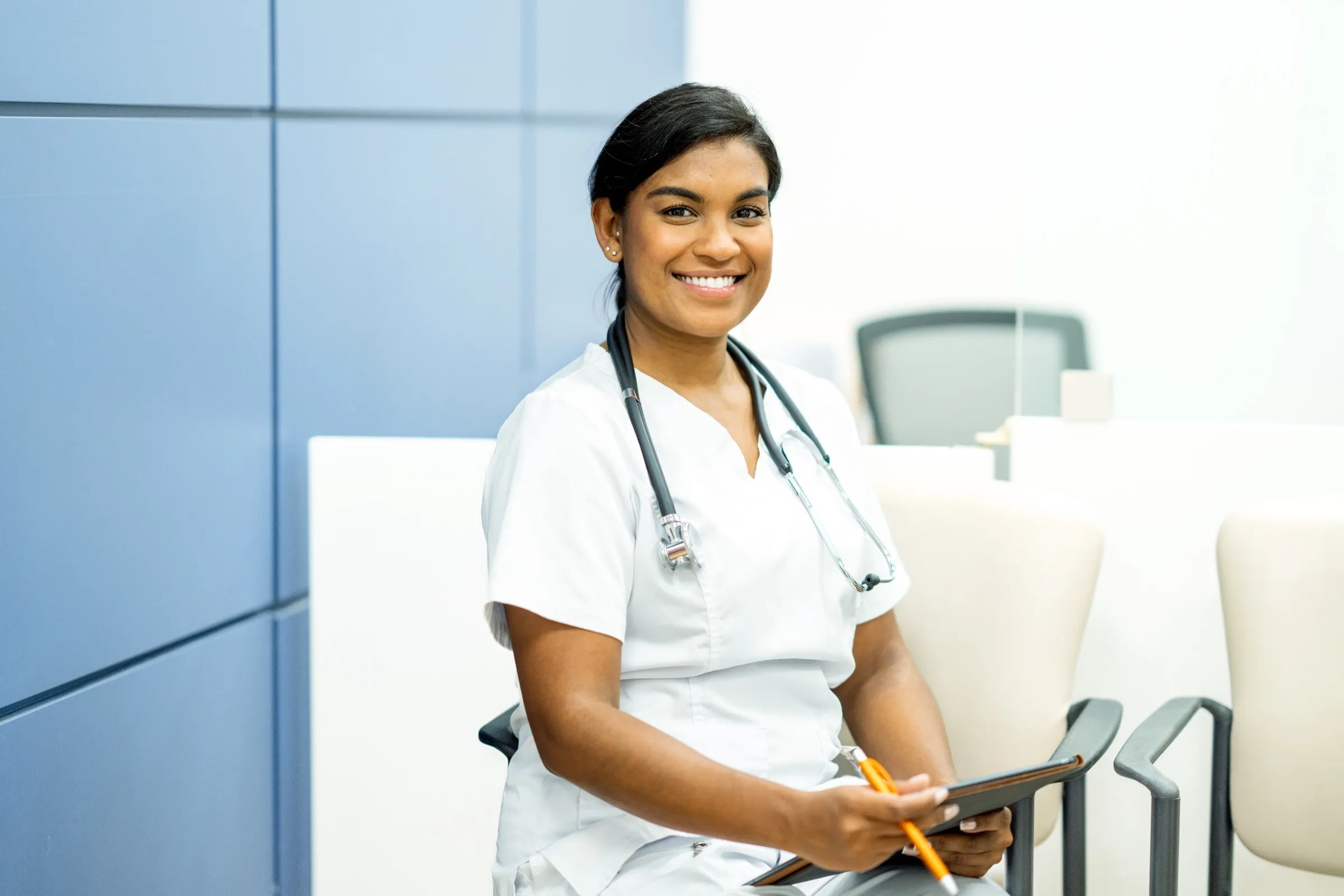 Nurse beside a hospital bed