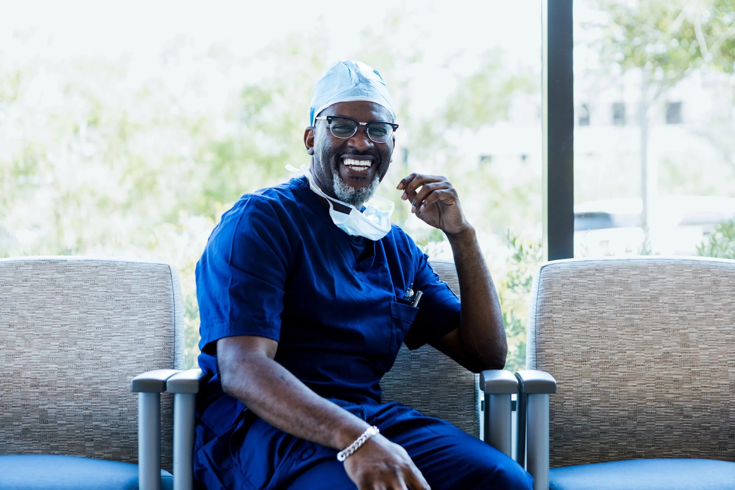 Surgeon seated in a hospital waiting area