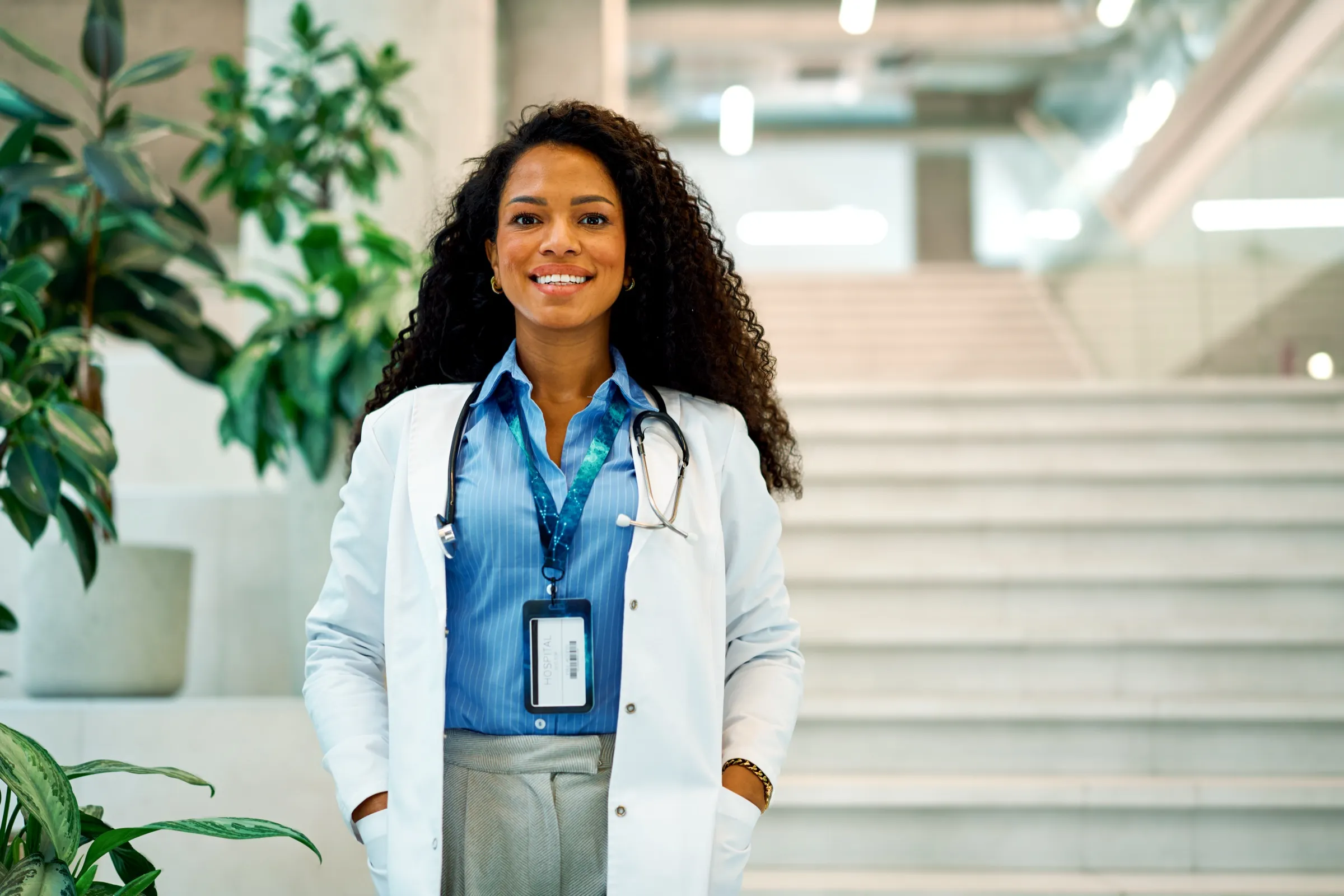 Physician standing in a hospital lobby